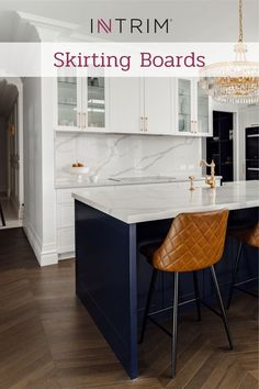 an image of a kitchen with white cabinets and marble counter tops that has the words in trim on it