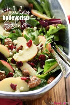 a salad with apples, cranberries and walnuts is shown in a bowl