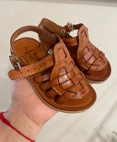 Cute Mexican leather huaraches !   Huaraches are hand made, authentic Mexican leather material !  Synthetic sole.  Cute brown huaraches to wear with most outfits even for formal events.  Please measure your child foot from toe to heel to make sure they will fit.  We accept exchanges ONLY within 7 days from delivery.  Buyers pay for all shipping cost.  SIZE 2US sole length 10.5 cm. SIZE 3US sole length 11.5 cm. SIZE 4US sole length 12.5 cm. SIZE 5US sole length 13.5 cm.  SIZE 6US sole length 14.5 Brown Closed Toe Sandals With Soft Sole, Casual Brown Sandals With Soft Sole, Leather Huaraches With Soft Sole For Summer, Summer Leather Huaraches With Soft Sole, Casual Handmade Brown Sandals, Casual Brown Handmade Sandals, Handmade Brown Huaraches For Spring, Adjustable Brown Closed Toe Huarache Sandals, Spring Brown Huaraches With Woven Sole