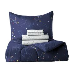 three sheets and two pillow cases on top of each other with stars in the sky