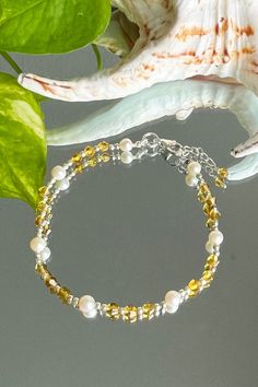 Abundance Pearls and Yellow Crystals Bracelet is an empowering accessory that infuses your everyday life with love and abundance. Pearls usher in Love, Beauty, and Wealth, while Yellow Crystals attract wealth, abundance, and growth. Oxidized sterling silver beads and spacers add an elegant touch to this beautiful balancing and healing bracelet. Create a stylish layered look by pairing it with a bangle or other layering bracelets. Pearls: Love, Beauty, Wealth Yellow Crystal: Radiance - Happiness Bracelets Pearls, Layering Bracelets, Yellow Crystals, Wealth Abundance, Himalayan Quartz, Yellow Pearl, 108 Mala Beads, Moonstone Crystal, Attract Wealth