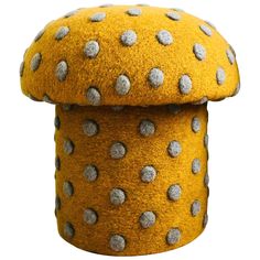 a yellow and gray polka dot covered object