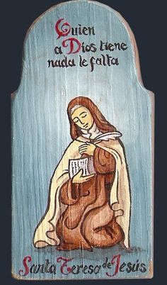 a wooden plaque with an image of the virgin mary holding a book in her lap