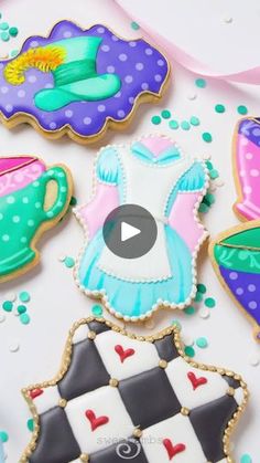 decorated cookies are displayed on a table