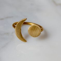 The perfect ring to add to your every day wear. Super delicate and unique. The brass ring is adjustable from sizes 6-9. Details: Designed and handmade in the USA. Sun And Moon Ring, Sun And Moon Rings, Polymer Clay Ring, Cellulose Fiber, Gold Sun, Moon Ring, Ohio Usa, Gold Moon, Brass Ring