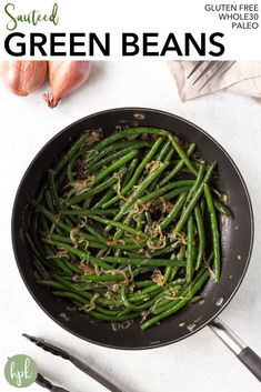 cooked green beans in a skillet with garlic on the side and text overlay