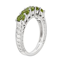 Add timeless charm to any outfit with this spectacular peridot ring. Click on this JEWELRY & WATCHES GUIDE to learn about fit, styles, materials and more!Ring Details: Width: .16-in. Metal: rhodium-plated sterling silver Features: chevron-textured band & milgrain details Gemstone Details: Gemstone type: genuine peridot Cut: round Setting: prong  Size: 10. Color: Green. Gender: female. Age Group: adult. Peridot Stone, Right Hand Rings, Ring Sale, Citrine Stone, Citrine Ring, Peridot Ring, Ring Silver, Sterling Ring, Stone Rings