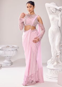 Our beguiling semi ethnic saree makes a dreamy walk at any occasion. Encapsulate the detailed embellishments in this rhythmic silhouettes that translate to everyday poetry. Pearl is a significant element of this collection and so with other elements, highlights the sleeves and border of the saree. The blouse has a halter neck with cold shoulder sleeves. The ring goes in the center highlighting the drape of the saree. Punjabi Dress Design, Ethnic Saree, Sharara Gharara, Punjabi Dress, Ethnic Sarees, Western Wedding, Wedding Service, Bride Bridal, Black Bow