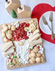 a wooden board topped with lots of food