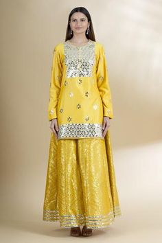 Shop for Neha Khullar Yellow Chanderi Silk Kurta Gharara Set for Women Online at Aza Fashions Designer Festive Sharara With Gota Work, Designer Wear Sharara With Gota Work For Festive Season, Festive Sharara With Mirror Work, Designer Sharara With Mirror Work For Eid, Festive Gota Work Sharara In Chinon, Designer Mirror Work Sharara For Eid, Designer Eid Sharara With Mirror Work, Semi-stitched Sharara With Mirror Work For Festive Occasions, Festive Sharara With Mirror Work And Traditional Drape