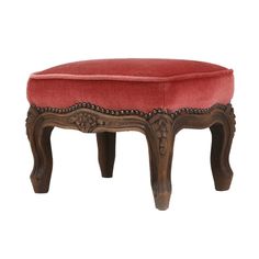 the foot stool is made from wood and red fabric