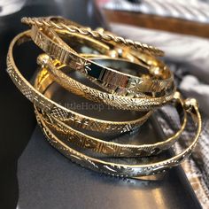 The absolute hottest style of the season!! These bangles 18k gold plated stainless steel cuff, stacking bangle bracelet bundles are a perfect gift for a special women. Treat yourself or a loved one. These unique bracelets will enhance any outfit. All bracelets have a diameter of 7cm but can be adjusted. and will fit most wrists size. All bracelets have a width of 5mm. The bracelets are made from a high quality stainless steel- tarnish free!💖 🌸See our entire jewelry collection here: https://www Gold Bangles 4 Set, Bangle Stacking, Timeless Gold Hand Set Bangle, 8 Bangles Gold Set, Gold Hand Set Bangle For Everyday Luxury, Jewelry Collection Aesthetic, Gold Jewelry Stack, Bangles Gold, Hand-set 14k Gold Bangle