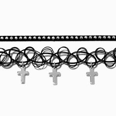 Expand your choker options with this faithful twosome. The two-pack set includes a black ribbon design and a black tattoo-style choker that has dangling silver-tone cross designs. Pack Size: 2Length: 10 in. + 3 in. extender / 25.4 cm. + 7.62 cm. extenderClosure: Lobster clasp, Stretch fitMaterial: Plastic - Claire's Black Ribbon & Tattoo Cross Dangle Choker Necklaces - 2 Pack Adjustable Black Cross Choker, Adjustable Silver Cross Choker, Black Ribbon Tattoo, Tattoo Cross, Crown Hair Clip, Sensitive Ears Earrings, Piercing Kit, Ribbon Tattoos, Flower Crown Hairstyle