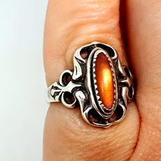 Very elegant ring to attract all eyes. Long live the glamor! Ring with beautiful details. Made of 925 silver and orange stone. Circa 1960. Weight: 4.16 grams - Dimensions: 15.80 mm which corresponds approximately to a size 5 1/2 USA. Composition: ** Sterling silver stamp. ** Orange agate. To see photos. We love the patina of time, but if you don't like it, you can spend some time cleaning and it will be perfect. The condition is good, with signs of use. It is not new, please see the photos, whic Vintage Silver Oval Opal Ring, Vintage Silver Opal Cabochon Ring, Vintage Silver Opal Ring With Oval Shape, Vintage Silver Moonstone Ring With Polished Finish, Antique Silver Oval Cabochon Ring, Handmade Silver Vintage Opal Ring, Vintage Handmade Silver Opal Ring, Handmade Vintage Silver Opal Ring, Vintage Orange Gemstone Jewelry