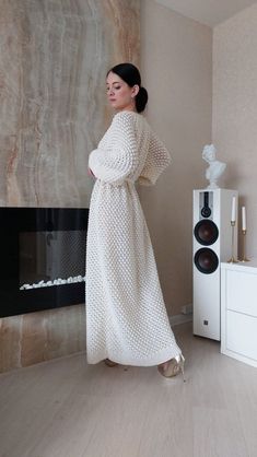 White hand knit sweater robe for women. Popcorn knit long cardigan in wool. Ankle length chunky knit oversized sweater coat with belt. Popcorn knit ankle length cardigan MADE TO ORDER Color: 450 Pearl (as shown) Yarn composition: 50% wool, 50% acrylic Fastens with the knitted belt SIZE CHART Size XS: Width: 50-52 cm Length: 135-140 cm Size S: Width: 53-54 cm Length: 135-140 cm Size M: Width:55-56 cm Length: 135-140 cm Size L: Width: 57-58 cm Length: 135-140 cm Size XL: Width: 59-60 cm Length: 13 Cardigan For Dress, Oversized Sweater Coat, Long White Cardigan, Knit Long Cardigan, Cardigan For Women, Warm Cardigan, Textured Cardigan, Long Knit Cardigan, Cardigan White