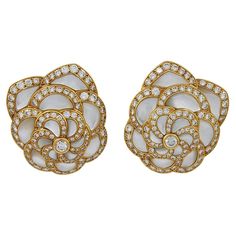 VAN CLEEF & ARPELS Diamond, Mother of Pearl Flower Earrings A pair of 18k yellow gold flower motif ear clips, set with diamonds and mother of pearl, signed Van Cleef & Arpels. dimensions approx. 1.25″ in length by 1″ by width Signed "VAN CLEEF & ARPELS"; circa 1980s Van Cleef Arpels Diamond, Pearl Flower Earrings, Gold Vans, Van Cleef & Arpels, Van Cleef And Arpels, Ear Clips, Mother Of Pearl Earrings, Pearl And Diamond Earrings, Flower Motif