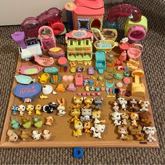 there are many toys on the floor and one is in the middle of it's display