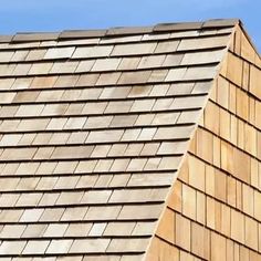 a close up view of a wooden shingled roof