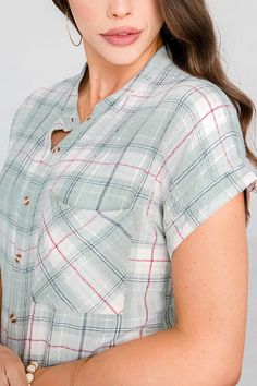 Plaid, but make it sunny! The Grace & Lace Short Sleeve Favorite Plaid is the warm weather version of your Favorite Button Up Plaid, perfect for embracing warmer days! Ultra soft and lightweight, this button up mint plaid top features the same stretchy fabric blend as the long sleeved version, for all-day comfort that flatters your shape. The mandarin collar, short sleeves and trendy soft color palette keeps this plaid fresh for any season. Style buttoned up or as a layer over tanks paired with your favorite light denim washes for an easy, everyday look! Casual plaid button-up top with short dolman sleeves. Fabric is woven with some stretch. Fit is true to size, stay in your normal size. If between sizes, size up for a more relaxed fit. * These are not an oversized design like the Favorite Summer Plaid Tops With Buttons, Plaid Buttoned Tops For Summer, Casual Plaid Tops For Daywear, Plaid Short Sleeve Beach Top, Everyday Plaid Summer Tops, Plaid Tops For Everyday Summer Wear, Casual Plaid Tops With Placket, Plaid Tops With Button Closure For Day Out, Plaid Tops With Button Closure For Summer