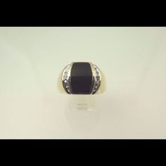 Hi, Here We Have A Beautiful 10k Two Tone Gold Black Onyx With Diamonds Men's Ring. Weight Is 8.7g. Width Is 14.85mm. Ring Has Three Brilliant Round Cut Diamonds On Each Side Of The Black Onyx Totaling Approximately 0.05ct. The Perfect Gift For Your Loved One. Buy With Confidence, We Only Sell Top Quality Items. Comes With A Free Gift Box. Metal: Two Tone Gold (White/Yellow) Main Stone Color: Black Metal Purity: 10k Occasion: Birthday Sizable: Yes Ring Size: 13.5 Main Stone: Onyx Designer Black Rings For Anniversary, Designer Black Ring With Black Enamel, Luxury Onyx Rings For Formal Occasions, Designer Black Enamel Ring, Designer Black Enamel Rings For Gift, Formal Yellow Gold Onyx Rings, Modern Black Rings For Formal Occasions, Formal Black Enamel Fine Jewelry Rings, Yellow Gold Rings With Black Enamel And Diamond