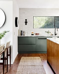 the kitchen is clean and ready to be used as a dining room or family room