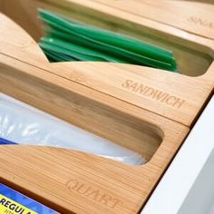 a close up of some items in a drawer with labels on the bottom and inside