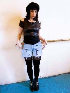 These are high waisted upcycled, washed out and totally rad jean shorts! They are shredded and edgy for that rocker chic look! There are ankhs and Siouxsie  inspired eyes drawn on with purple and black fabric markers. These have that 80's walk like an egyptian Venice Beach sea punk look! These shorts fit great and are super comfy with that great levi look. One could sport these with all black for that gothy vibe. These would also look great with a t-shirt tucked in and some chunky 90's shoes!  Measurements: Waist: 30 inches Hips: 39 inches Length: 14 inches These are 550 Levis Best to hand wash Edgy Stretch Jean Shorts, Punk Style Spring Shorts, Edgy Stretch Cutoff Jean Shorts, Punk Style Jean Shorts For Spring, Grunge Fitted Streetwear Shorts, Fitted Grunge Shorts For Streetwear, Edgy Fitted Cutoff Shorts, Edgy Ripped Fitted Jean Shorts, Punk Ripped Denim Shorts