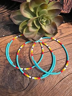 This stylish Serape Wrap Bracelet ~ Turquoise is a dainty western-inspired piece that's handcrafted by a small business in the USA. Featuring serape beads that wrap around your wrist, it's a unique and fashionable accent for any outfit. Wear alone or stack with other colors to make the perfect western stack. Shown with our Laney Earrings Artisan Turquoise Hand Wrapped Wrap Bracelet, Artisan Hand Wrapped Turquoise Wrap Bracelet, Southwestern Jewelry With Tiny Heishi Beads, Turquoise Hand Wrapped Bracelets For Festivals, Artisan Turquoise Wrap Bracelet For Festivals, Southwestern Hand Wrapped Adjustable Jewelry, Southwestern Adjustable Hand Wrapped Jewelry, Adjustable Southwestern Hand Wrapped Jewelry, Artisan Turquoise Beaded Bracelets Adjustable