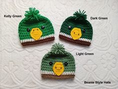 three crocheted hats with different designs on them