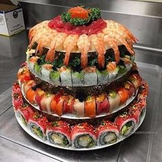 three stacks of sushi stacked on top of each other