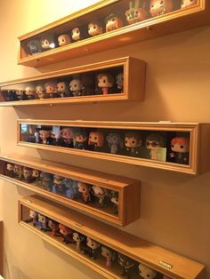 the shelves are filled with many different kinds of pop vinyls on display in their cases