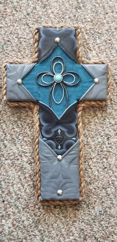 This beautiful cross is made from worn cowboy boots, rope, and silver accents.  It will warm any room. Western Cross, Beautiful Cross, Cow Boy, Silver Accents, Wall Hangings, Cowboy Boots, Cowboy, Wall Hanging, Textiles