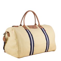 This duffle is a perfect size to bring as a carry-one or in addition to your other bags. There's a handy trolly slip on the back so it slips easily over your rollie-bag handles. With a full leather bottom and details, this bag will add some style back to your travels! Matching travel kits also available. (The Natural bag has black /natural striped webbing). This item can also be monogrammed!Product Overview: Dimensions: 18" x 10" x 10" with a 6" handle drop, 55" adjustable / detachable strap Hea Beaded Bag, Travel Kits, Pocket Mirror, Phone Charger, Bag Handle, Easy Access, Real Leather, Cotton Canvas, Shoulder Strap