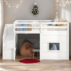 there is a bunk bed with stairs to the top and below it, next to a red rug on the floor