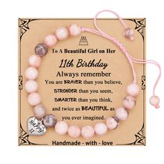 a bracelet with pink beads and a heart charm on the front, saying i'm a beautiful girl on her 11th birthday