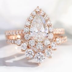 lab diamond ring stack rose gold pear diamond halo engagement ring set La More Design Jewelry Halo Diamond Ring Set, Pave Setting Ring, Pear Diamond Rings, Rose Gold Halo, Detailed Engagement Ring, Engagement Ring For Her, Lab Diamond Engagement Ring, Diamond Wedding Rings Sets, Pave Band