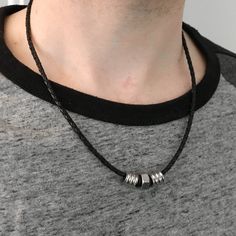 "A fantastic simple yet classy industrial necklace. Looks great on men and women. The braided black leather necklace cord is 3mm in diameter with stainless steel lobster clasp closure. The centerpiece of this tribal design necklace is a stainless steel nut. On either side of the hex nut are black silicone donuts which not only create visual interest, they also provide padding to the outer stainless steel tubes. All together these components measure approx 1 1/8\" in length. The necklace ships in Tribe Necklace, Industrial Necklace, Black Leather Necklace, Industrial Jewelry, Hex Nut, Necklace Cord, Leather Corded Necklace, Bangle Bracelet Set, Stainless Steel Bangles