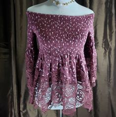 This Ditsy Floral Smocked Off Shoulder Turnic Lace Top. This Easy Fit, Romantic Lace Top Features Crochet Lace In A Classic Floral Lace Pattern. This Off The Shoulders Off The Shoulder Neckline Too! It's So Feminine! The Smocking Is Nice Since It Will Help Keep This Top In Place While Adding Stretchy Comfort! This Top Features With Lace Sleeves, 100% Rayon Crochet 100% Cotton. Junior Tops. Off-shoulder Top With Smocked Bodice For Fall, Flowy Smocked Top For Brunch, Non-stretch Smocked Top For Fall, Non-stretch Long Sleeve Smocked Top, Spring Smocked Top With Smocked Bodice, Bohemian Smocked Top For The Beach, Flowy Bohemian Smocked Top, Chic Smock Peasant Top For Day Out, Spring Bohemian Smocked Top