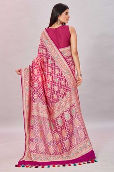 Elegant ombre magenta georgette Banarasi sari is a perfect choice for festive occasions! It is enhanced with zari minakari jaal and comes with a matching blouse piece. Disclaimer: The shown stitched blouse on the model is for display purpose only. The saree comes with a matching blouse piece and finished with fall and piko. Georgette Banarasi Saree, Banarasi Sari, Tussar Silk Sarees, Indian Clothing Store, Latest Designer Sarees, Tussar Silk Saree, Banarasi Saree, Indian Clothing, Banarasi Sarees