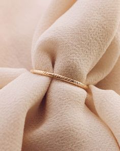 Rays Dainty Ring Band 14K Gold Filled Size 3-12 Width: 1.2mm Please note there are slight color variations or an appearance of a seam where the joints of the ring has been soldered. Due to their handmade nature, keep in mind that solder marks are visible and normal to have. Minimalist 14k Gold Ring With Decorative Band, Minimalist Yellow Gold Rings With Decorative Band, Minimalist Yellow Gold Ring With Decorative Band, Dainty Diamond Cut Round Band Rings, Minimalist 14k Gold Band Ring, Dainty Yellow Gold Toe Ring Bands, Dainty 14k Gold Diamond Cut Bands, Dainty Yellow Gold Rings With Diamond Cut, Adjustable 14k Gold Band Rings