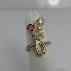 Estate 14k yellow gold french rose cut diamonds ruby ring. fine quality ring. clean white stones approx vs2. face of ring 24mm long. 5.2 grams. this ring is stunner. great shape. size 5.75. the rose cut is 5.10mm and the ruby is 4.6mm. the other diamonds are fine clean stones marked 14k. estate informed me its french. added that because of the estate. Exquisite Multi-stone Yellow Gold Ruby Ring, Exquisite Gold Multi-stone Diamond Ring, Victorian Multi-stone Yellow Gold Diamond Ring, Exquisite Yellow Gold Multi-stone Diamond Ring, Yellow Gold Flower Ring With 17 Jewels For Anniversary, Yellow Gold Multi-stone Ruby Ring, Unique Multi-stone Ruby Ring In Yellow Gold, Formal Multi-stone Yellow Gold Flower Ring, Multi-stone Ruby Ring In Yellow Gold