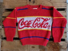 This Coca-Cola sweater is a rare piece of vintage Coke memorabilia. In excellent condition with a very cool textured finish where you can see Coca-Cola in raised letters along the red stripes. Bright and cheerful little sweater which would make a cool throw pillow, would fit a large teddy bear, or you could even put it on your kid! No holes or damage, very little pilling. See photos for measurements Please use coupon code LocalPickup at checkout to remove shipping fees and pick up in store in To Large Teddy Bear, Silly Clothes, Vintage Coke, Raised Letters, Vintage Coca Cola, Coca Cola Vintage, Code Promo, Knitting For Kids, Coca Cola