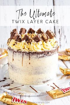 the ultimate twin layer cake is ready to be eaten with chocolate and candy on top