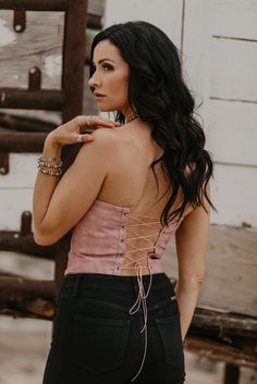 Corset style top with a western flair - peep that boot stitch detail. Full lace up back to ensure the best fit and comfort. Wear solo or pair over the top of your favorite blouse to create a layered look. Rodeos, music fests, and every event in between. Material: 100% Polyester Small (2/4) | Medium (6/8) | Large (10/12) Trendy Fitted Tops For Rodeo, Fitted Lace-up Back Top For Spring, Casual Spring Tops With Lace-up Back, Bohemian Corset For Festivals, Fitted Western Tops For Summer, Fitted Western Style Spring Blouse, Western Style Blouse For Spring Rodeo, Fitted Western Blouse For Spring, Fitted Western Style Blouse For Spring