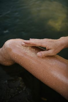 Indulge in the luxurious Guava Helichrysum Shea Body Scrub, a heavenly blend of guava and helichrysum essential oils infused with nourishing shea butter. This invigorating sugar scrub gently exfoliates and seals in moisture, leaving a subtle scent of osmanthus and vetiver on your irresistibly smooth skin. Elevate your shower routine with the shea butter and exfoliating sugar particles in this scrub as they gently buff away dead skin cells, revealing a soft and radiant complexion. Body Skin Photography, Corpus Naturals, Scrub Photoshoot, Body Scrub Aesthetic, Bath Scrub, Helichrysum Essential Oil, Vetiver Essential Oil, 5 Senses, Beauty Products Photography