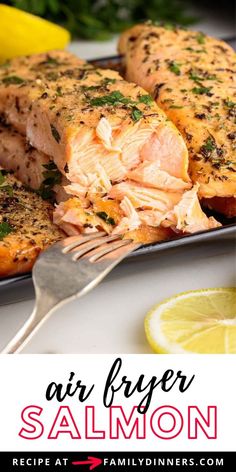 salmon fillets on a plate with lemons and parsley in the background text reads air fryer salmon salmon