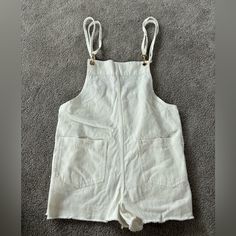 Nwt. Show Me Your Mumu Trude Romper In Seasalt. Size Small. White Bib Front Overalls With Pockets, White Casual Bib Front Overalls, Chic Cotton Overalls With Bib Front, White Overalls With Pockets, Sleeveless White Cotton Overalls, White Sleeveless Overalls For Spring, Chic Cotton Shortalls Overall, Chic Cotton Shortalls, White Overall Jumpsuits And Rompers With Pockets