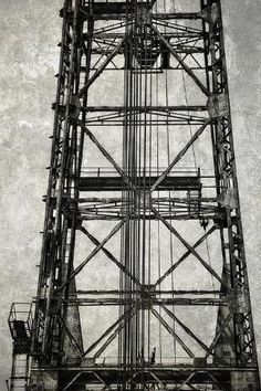 an old photo of the top of a tall tower