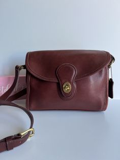 Classic Vtg Coach Devon Bag Burgundy currant color leather with brass hardware Roomy interior with zip pocket, outer slip pocket covered by a flap and secured with a turnlock Back slip pocket Adjustable 47" strap at longest Hang tag and chain Measures:10"L, 8"H, 3"W Made in the United States #0292-319 Flaw: dark stains on one side Cleaned, conditioned and ready to wear! Questions? Just ask More vtg coach styles/colors also available g117 Vintage Coach Luxury Satchel, Classic Flap Bag With Cc Turnlock Closure, Classic Travel Bag With Cc Turnlock Closure, Vintage Rectangular Bag With Cc Turnlock Closure, Leather Flap Bag With Cc Turnlock For Daily Use, Timeless Shoulder Bag With Cc Turnlock For Travel, Timeless Shoulder Bag With Cc Turnlock Closure For Travel, Vintage Shoulder Bag With Cc Turnlock For Formal Occasions, Classic Leather Shoulder Bag With Cc Turnlock Closure