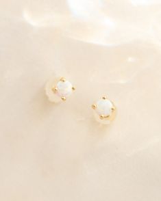 Love these tiny opal studs - they give your ears a sweet sparkle with their fiery red hue. A happy stone to make you smile all day! Details: -Gold Filled -White Iridescent Opal -Waterproof, Tarnish Resistant, Hypoallergenic Dainty White Opal Earrings, Minimalist White Opal Earrings, Tiny White Round Earrings, Everyday White Gemstone Earrings, White Round Stone Earrings For Gift, Happy Stone, Opal Studs, Fiery Red, Natural Opal